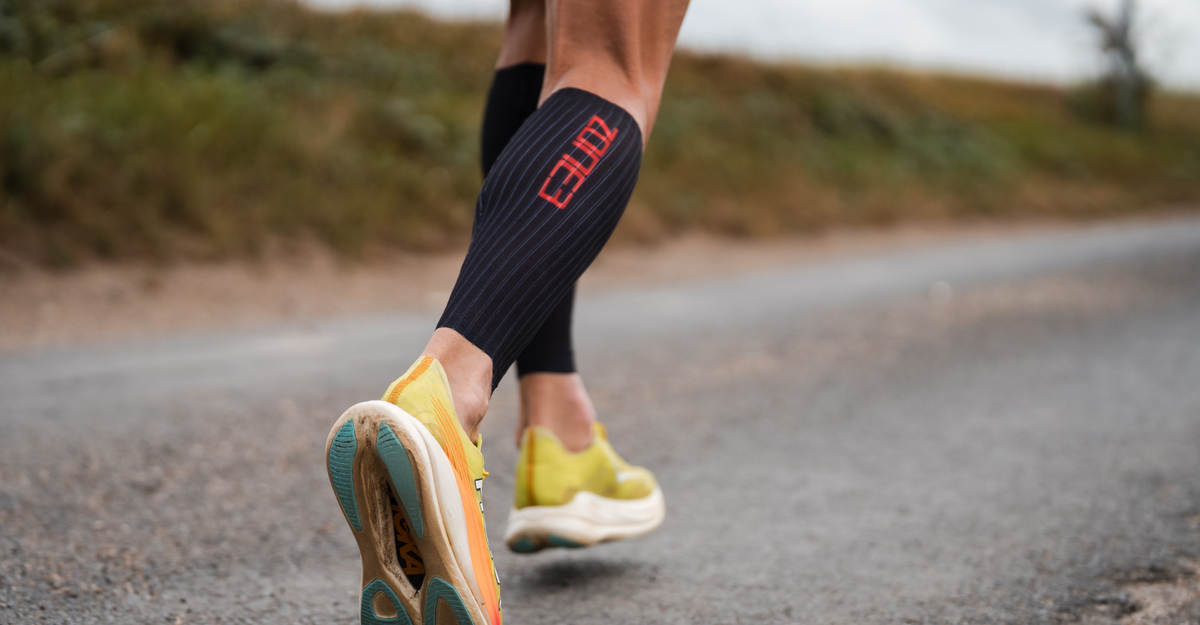 Person running wearing Zone3 trisuit with the Aeroforce-X II Calf Sleeves