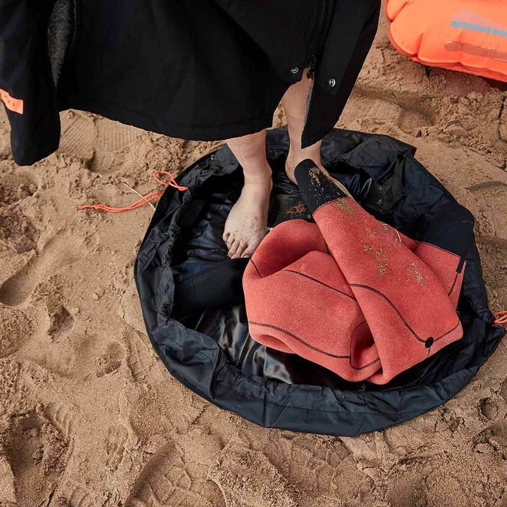 A Zone3 wetsuit changing mat and bag on a white background.