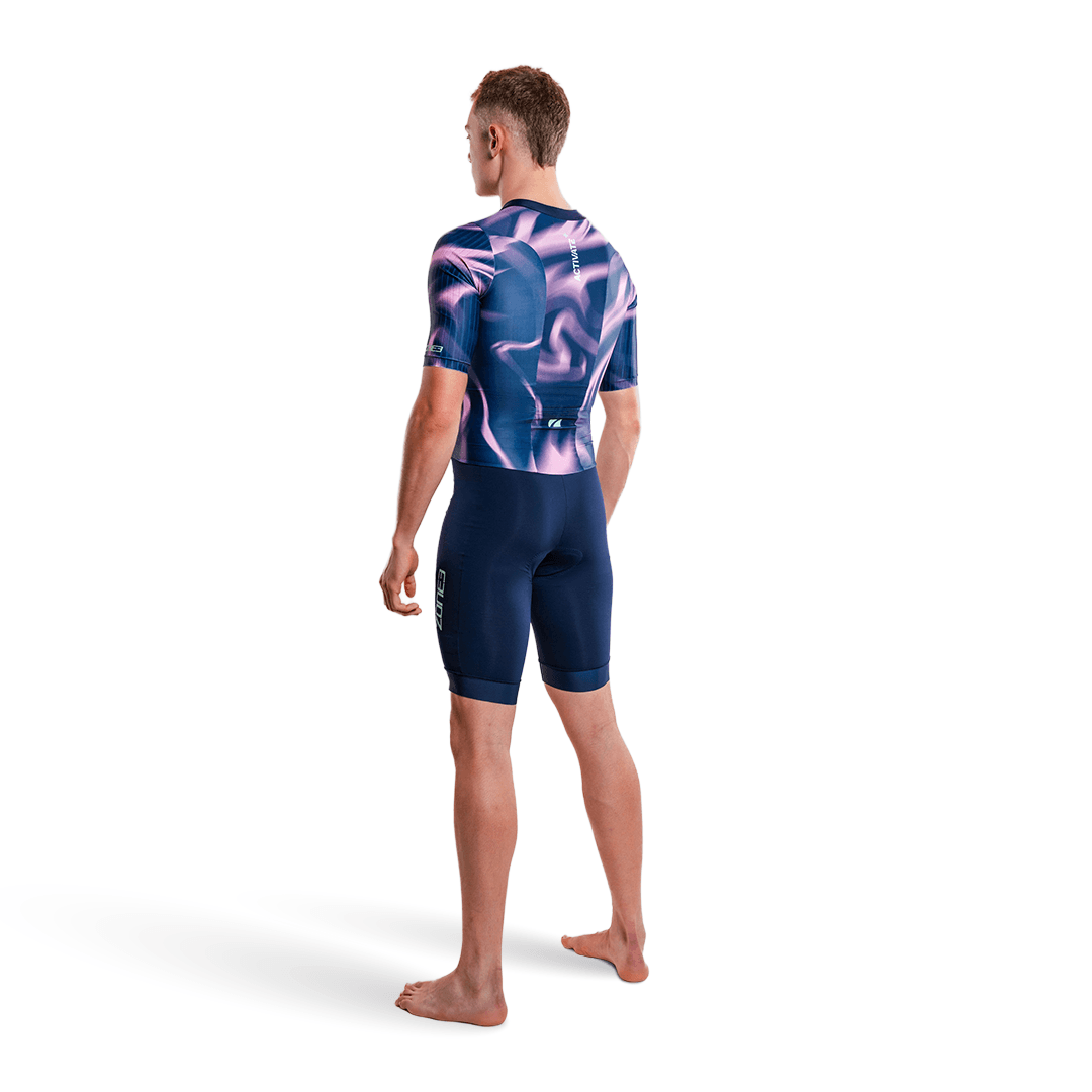 Athlete wearing the Zone3 Activate short sleeve trisuit in navy on a white studio background.